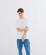 Model in a white t-shirt and wide leg jeans