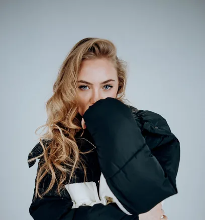 Model in a tailored black and white jacket