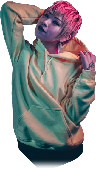 Model in a yellow hoodie lit by festival neon